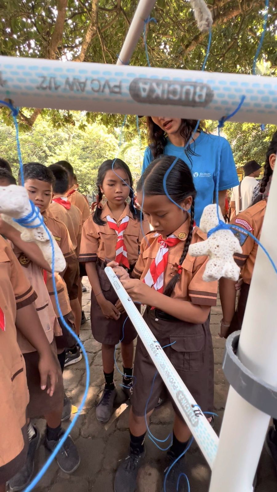 Students participating in marine conservation activity outdoors